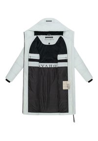White puffer coat with a black interior. Features zippered pockets, a logo on the lining, and a care label attached inside.