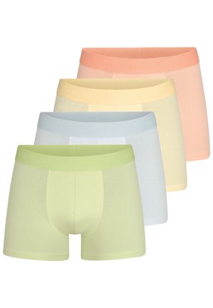 Quatre paires de boxers dans des couleurs pastel : vert clair, bleu clair, jaune doux et pêche doux. Chacun comporte une ceinture élastique avec le logo "INDICODE".