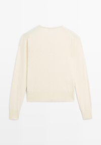 Light beige knitted sweater, featuring long sleeves, a round neckline, and a ribbed hem. Smooth texture with a slightly loose fit.