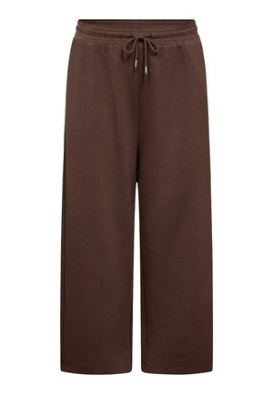Braune weit geschnittene Jogginghosen aus weichem Stoff, mit einem elastischen Bund mit Kordelzug und seitlichen Taschen.