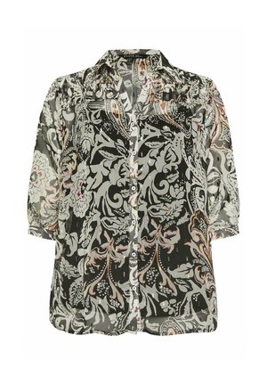 Blusa floreale bianca e nera con maniche a metà, chiusura a bottoni frontale e un tessuto leggero e trasparente. Presenta un sottile motivo con dettagli arricciati.