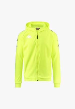 Hoodie zippé néon jaune vif avec une capuche doublée, des poignets côtelés, et des détails de logo sur la poitrine et les manches. Fait en tissu léger.