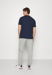 Champion BASIC CUFF PANTS - Tepláky - grey melange