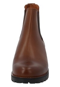 Botín de cuero marrón hasta el tobillo con paneles elásticos en los laterales y puntera redonda. Presenta una suela de goma texturizada y detalles de costura en contraste.