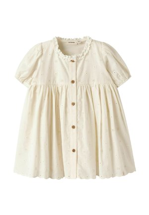 Detské šaty krémovej farby s krátkymi nafúknutými rukávmi, drevenými gombíkmi vpredu, výšivkou so vzorom dierok, zakončené vlnitým okrajom a s volánikovým výstrihom.