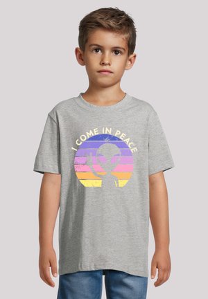 Gray short-sleeve T-shirt featuring a printed alien graphic in a circular, colorful sunset design with the text "I COME IN PEACE."