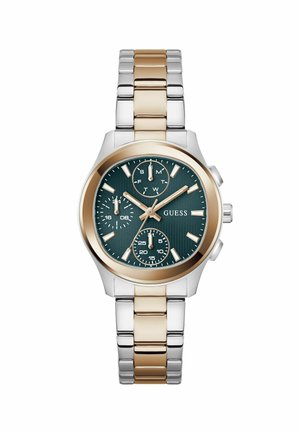 Reloj de pulsera de metal bicolor con eslabones en oro y plata, esfera de color verde oscuro, tres subesferas y manecillas y marcadores de hora en tono dorado, marca Guess.