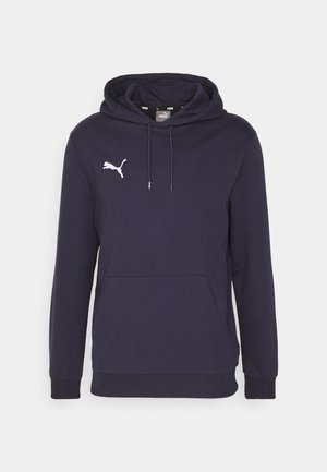 Marineblå sweatshirt med hætte, lange ærmer, ribbede manchetter og en frontlomme. Har et hvidt Puma-logo på venstre bryst. Materialet er en bomuldsblanding.