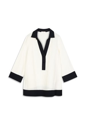 Túnica blanca con cuello y puños negros. Presenta una tapeta con cuatro botones y un corte relajado. Confeccionada con una tela ligera.