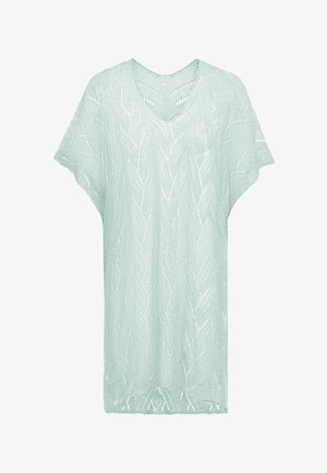 Vihreä, lyhythihainen neulepaita, jossa on V-pääntie. Paita on varustettu tekstuurilla, jossa on sahalaitakuviota ja avointa kudontaa, mikä tekee siitä hengittävän kankaan.