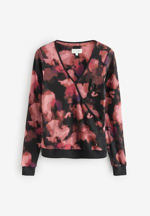 Long-sleeve pullover in a vibrant floral pattern with pink, black, and purple hues. Features a deep v-neck and ribbed texture.