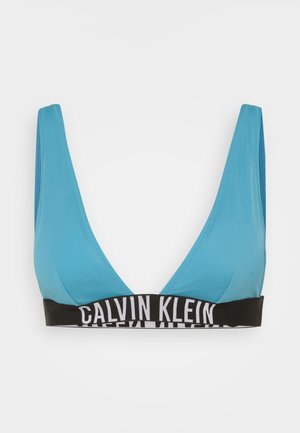 Blaue Dreiecks-Bralette aus glattem Stoff, ausgestattet mit einem schwarzen elastischen Band mit weißer "CALVIN KLEIN"-Aufschrift am Rand.