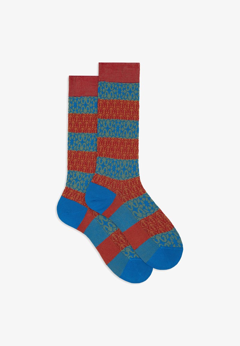 Red and blue patterned socks featuring vertical stripes. The design includes textured green accents in a repeating motif. Made from soft material.