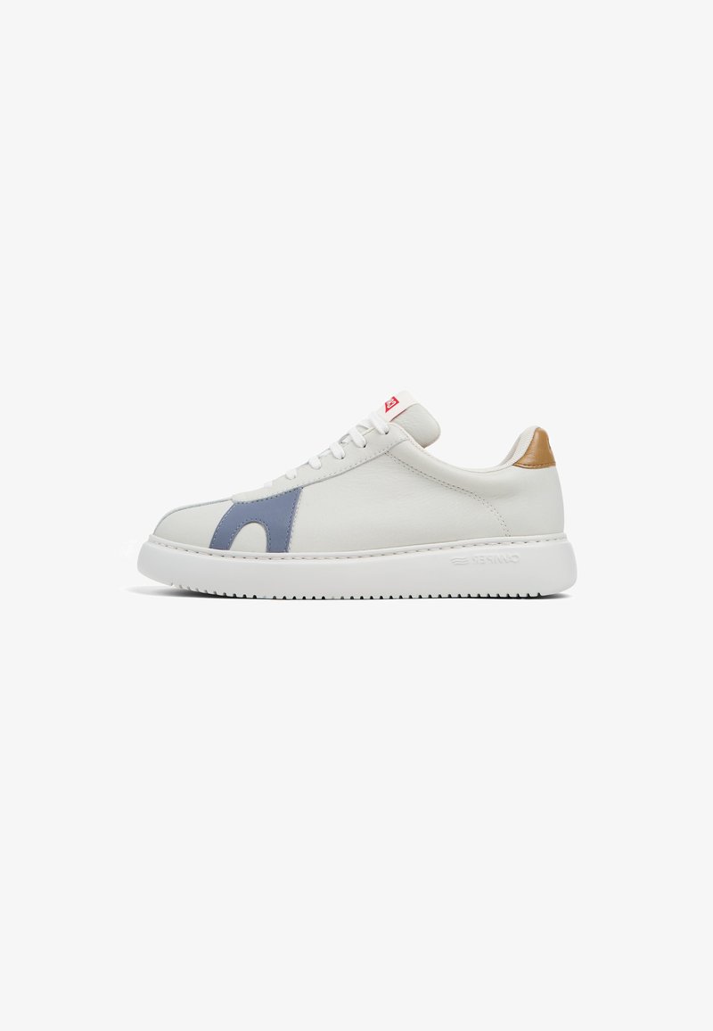 White leather sneaker with light blue accent, rounded toe, white rubber sole, and tan heel tab. Features flat white laces and red logo tag.