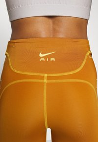 Nike Performance Leggings - ochre