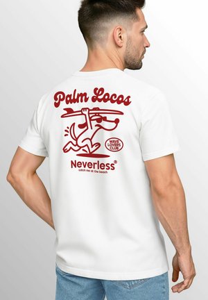 White cotton T-shirt with red graphic design featuring a dog holding a surfboard, "Palm Locos" text, and "Neverless" logo on the back.