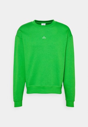 Jasnozielona bluza z długim rękawem z prążkowanymi mankietami i ściągaczem u dołu, z małą białą grafiką wieszaka na ubrania umieszczoną poniżej linii dekoltu.