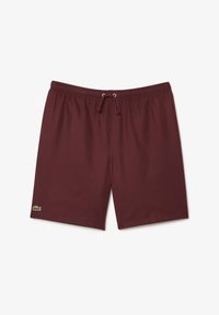 Burgundy simbyxor i lättviktstyg, med elastisk midja och dragsko, samt en liten grön logotyp på vänster framsida.