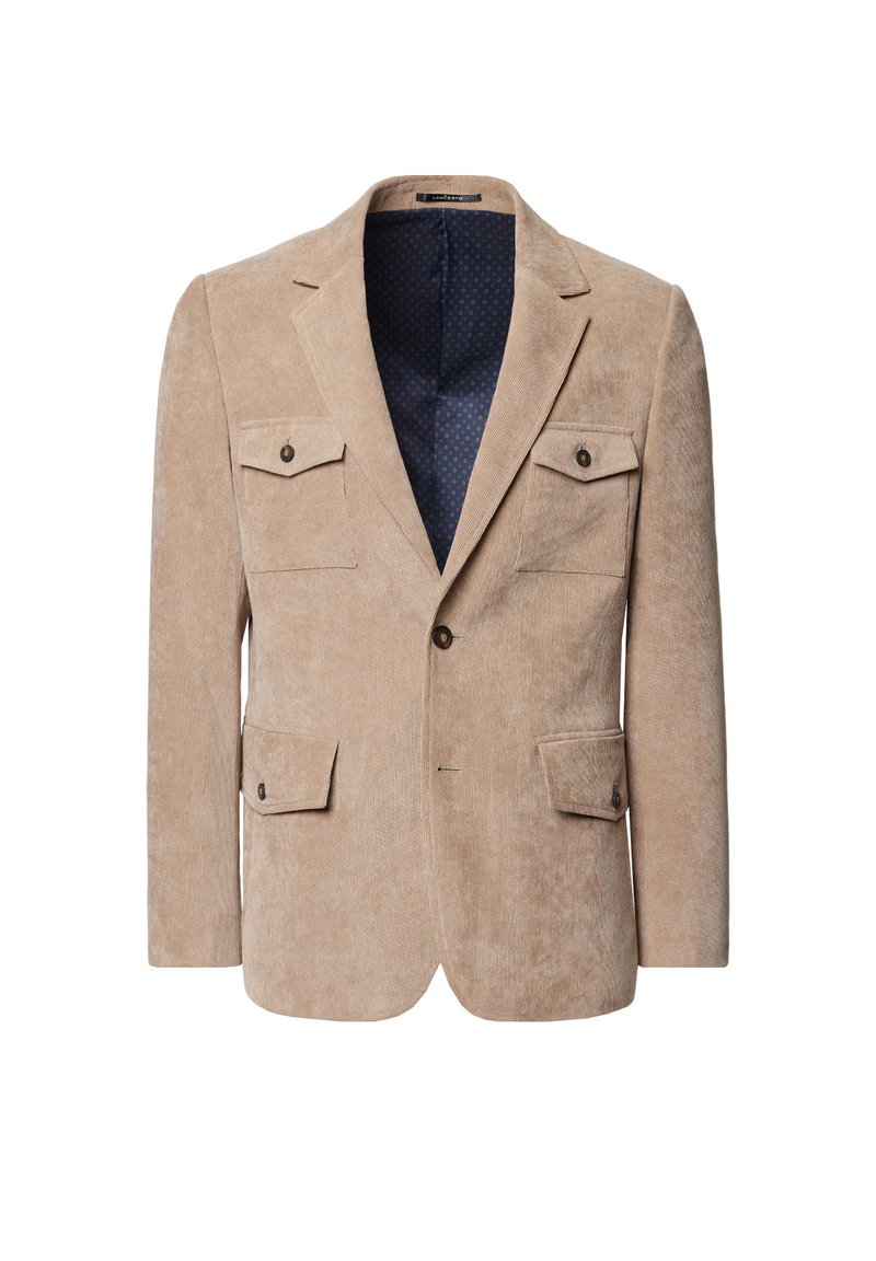 Beżowa marynarka z korduroyu z dwoma kieszeniami na piersiach, z zamknięciem na jeden guzik i niebieską podszewką w kropki. Dopasowany krój z długimi rękawami.