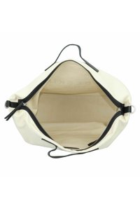 Canvas bag with black zipper, cream exterior, and beige interior; features dual handles and a smooth, unadorned texture.