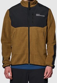 Brown and black color-block fleece jacket with a high collar, zip pockets, and a logo. Features textured fabric and fitted design.