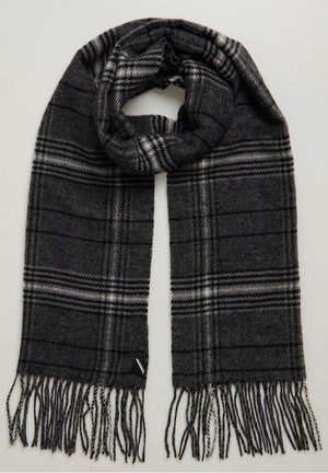 Écharpe en laine gris foncé à motif à carreaux noirs et blancs avec des extrémités effilochées, pliée en boucle vers le haut.