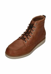 Brown leather high-top shoe with rounded toe, contrasting white sole, black laces, and metal eyelets. Stitching detail along the edges.