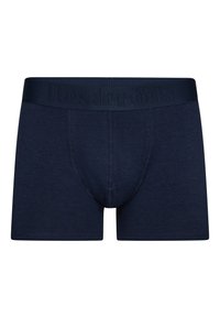 Mørkeblå boxer briefs lavet af blødt stof, med et tætsiddende elastikbånd med prægede mærkenavn og en formet pungen design.