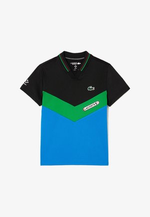 Zwarte polo met groen en blauw chevronontwerp. Voorzien van een ribgebreide kraag met rode en groene details. Lacoste-logo op de voorkant.