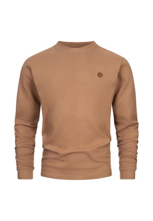 Barna bordás hosszú ujjú pulóver kerek nyakkal és egy kis kör alakú logóval a mellkasán. Puha textúrájú és testhez simuló fazon.