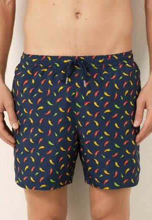Shorts de bain pour hommes en navy avec une taille élastique et un cordon de serrage, ornés de petits piments rouges, jaunes et verts.