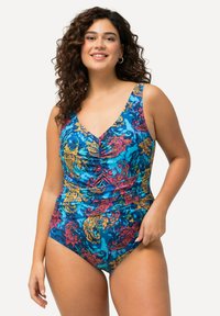 En enstyck baddräkt i blått med livfulla blommönster i rosa, gult och grönt; har en v-ringning och rynkade detaljer.