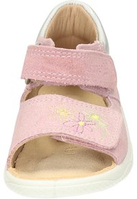 Pink suede sandal featuring floral embroidery in yellow, purple, and green. White rubber sole and adjustable velcro straps for secure fit.