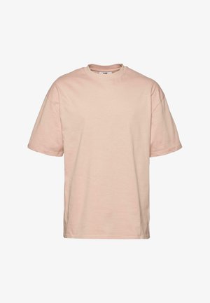 Tričko s krátkym rukávom a okrúhlym výstrihom v svetloružovej bavlne. Vyznačuje sa voľným strihom a hladkou textúrou. Bez viditeľných log alebo vzorov.