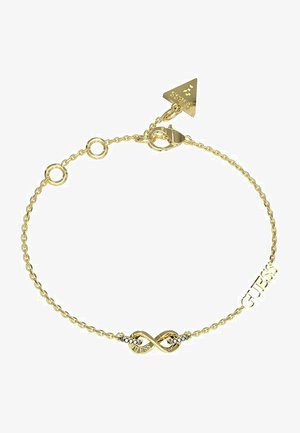 Das goldene Armband verfügt über ein Unendlichkeitssymbol und das Wort "GUESS", mit runden Gliedern und einem verstellbaren Verschluss. Strukturierte Oberfläche, polierte Akzente.