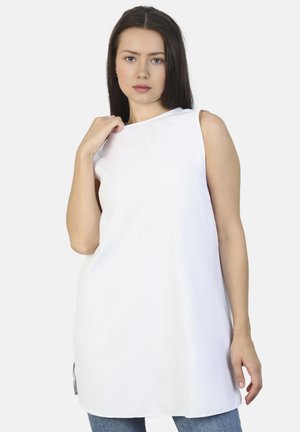 Tunic bianca senza maniche con una vestibilità comoda, texture morbida e scollo rotondo, dotata di una fessura laterale per facilitare i movimenti.