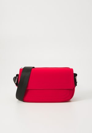 Red synthetic crossbody bag with a flap closure, black adjustable strap, smooth texture, and stitched detailing on the front panel.