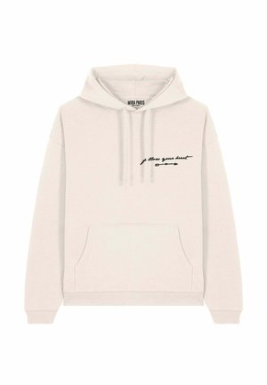 Lichte beige hoodie met een voorke pocket en een zwart tekstgraphic met de tekst "volg je hart" in combinatie met een pijlpuntontwerp.