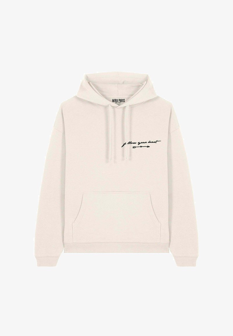 Sweat à capuche beige clair avec une poche avant et un graphique en texte noir portant l'inscription "suis ton cœur" accompagné d'un motif de flèche.