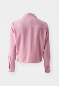 Red and white striped cropped shirt with a collar, long sleeves, and buttoned cuffs; made from a lightweight fabric with subtle texture.