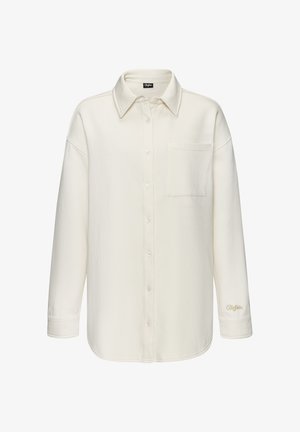 White, button-up shirt made of soft material with a collar, long sleeves, and a chest pocket. Features stitched detailing on the hem and sleeve.