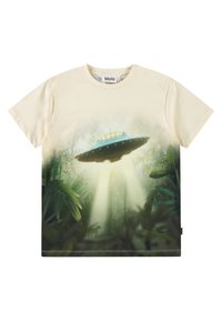 Bomuld T-shirt i cremet farve med trykt UFO og junglescene, med rund hals og korte ærmer. Designet inkluderer detaljer med grønne blade.