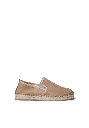 Beige canvas slip-on espadrille with braided jute sole and elastic side panel detail on a white background.