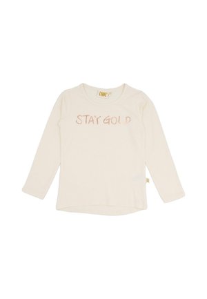 Chemise crème à manches longues avec l’inscription « STAY GOLD » imprimée sur la poitrine, sur fond blanc.