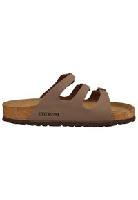 Prunad Birkenstock sandaalid kolme reguleeritava rihmaga, korkjalaga ja kummitaldaga. Sile materjal pehme tekstuuriga ning logodetailiga.