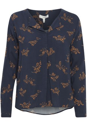 Blusa navy con maniche lunghe, stampa floreale in ruggine e crema. Presenta un colletto e un orlo leggermente più corto sul davanti. Realizzata in tessuto leggero.