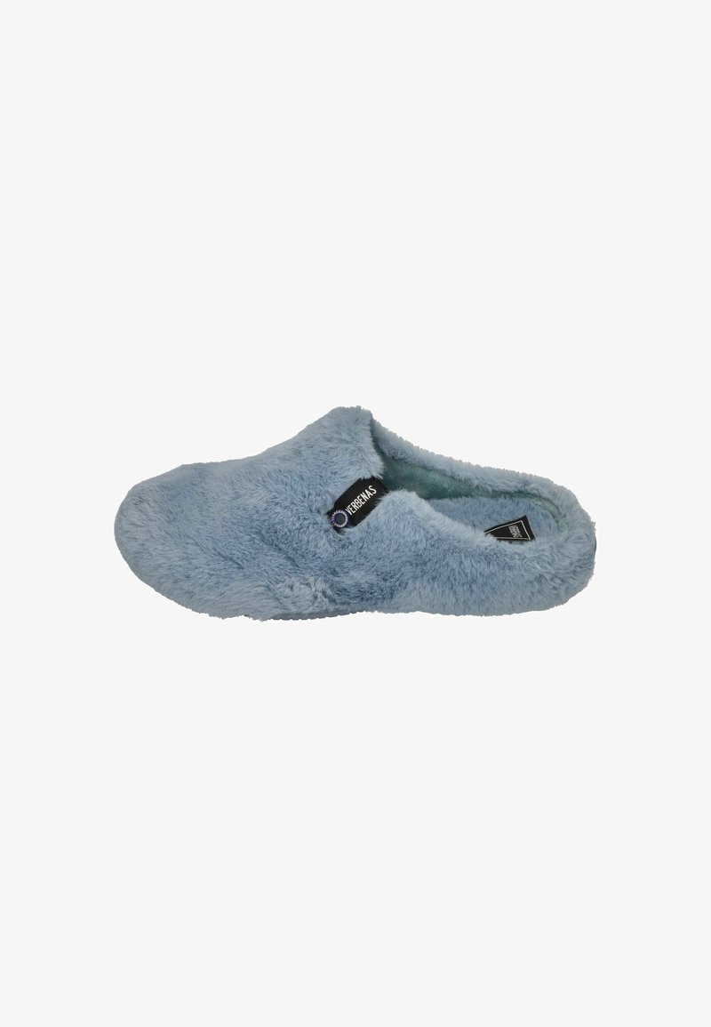 Blue fuzzy slippers with a soft, plush texture. Slip-on design and rubber sole. Tag visible on the side. No notable patterns or accents.