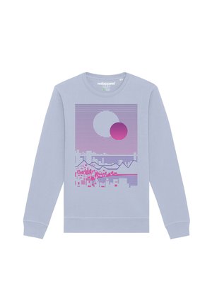 Sweatshirt violet clair avec un design graphique comportant des lignes horizontales, deux cercles et des formes angulaires dans des tons de rose et de violet.