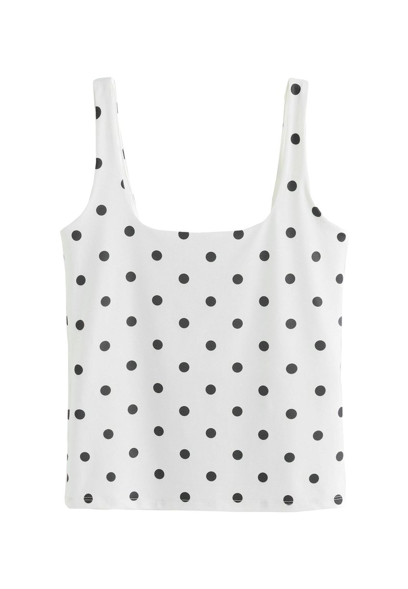 White tank top featuring black polka dots, made of a smooth fabric, with wide straps and a square neckline.