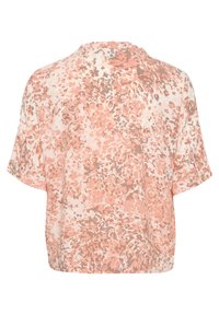 Maglietta a maniche corte di un rosa chiaro con motivi maculati in tonalità più scure. Vestibilità ampia, scollatura rotonda e leggera texture arricciata sul retro.